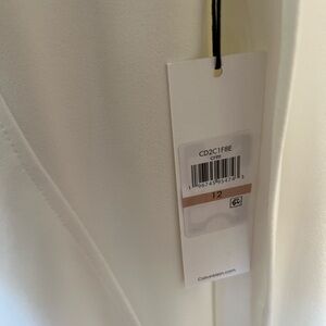 Gorgeous Calvin Klein white ivory dress. The dress has the cape attached.